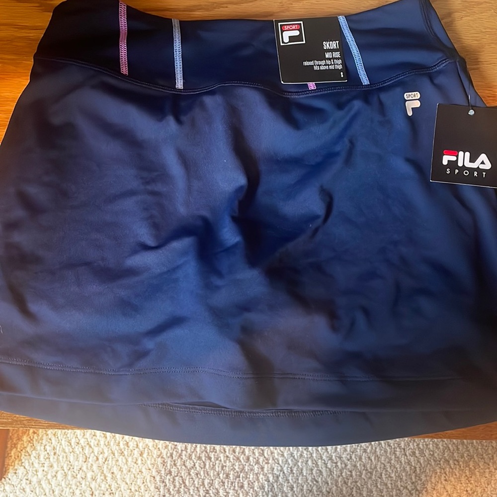 it is a skort , the brand fila, navy blue, small
